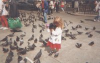 Jennifer feeding pigeons in Trafalgar 
Square
